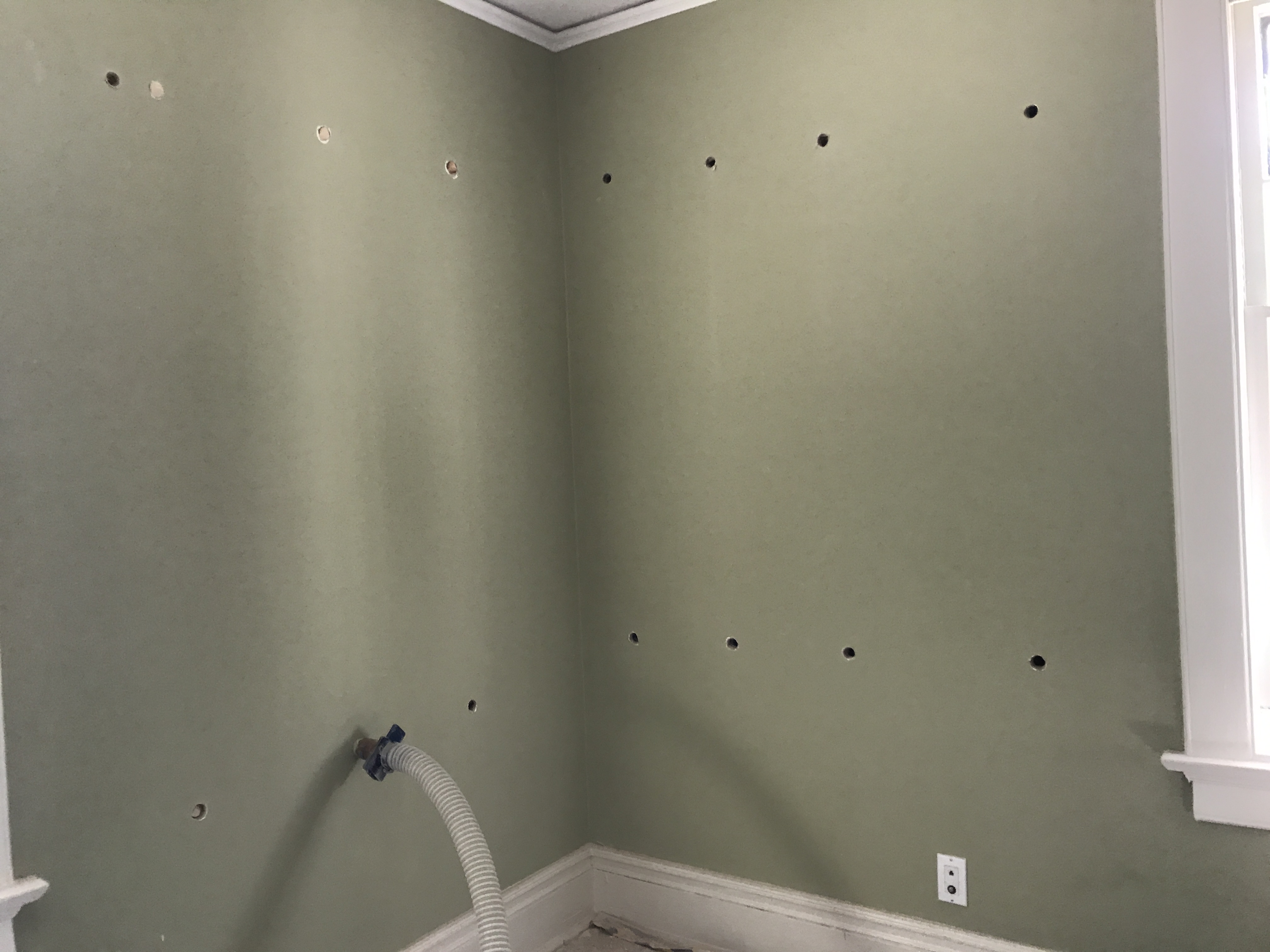 An insulation hose inserted through an interior access opening.