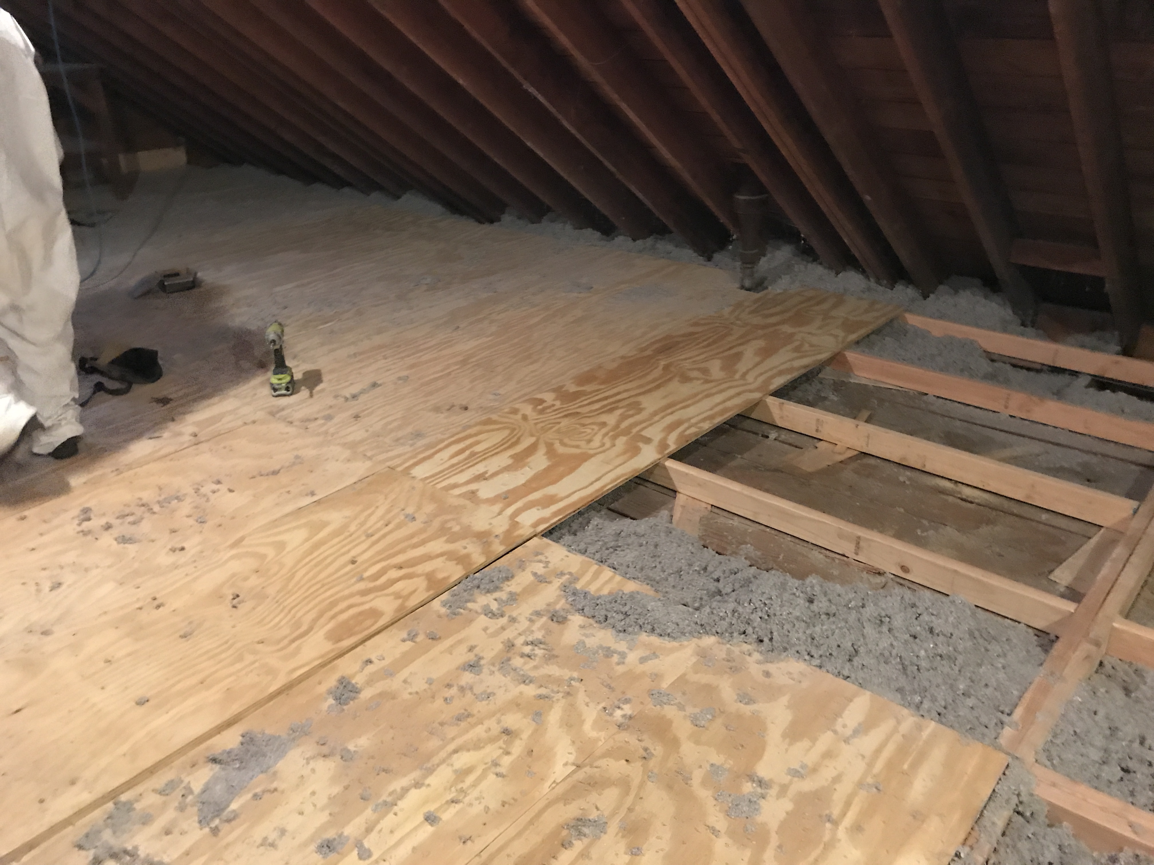 Floor sections opened during an attic insulation project.